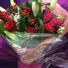 12 Red Roses With Berries and Lilies